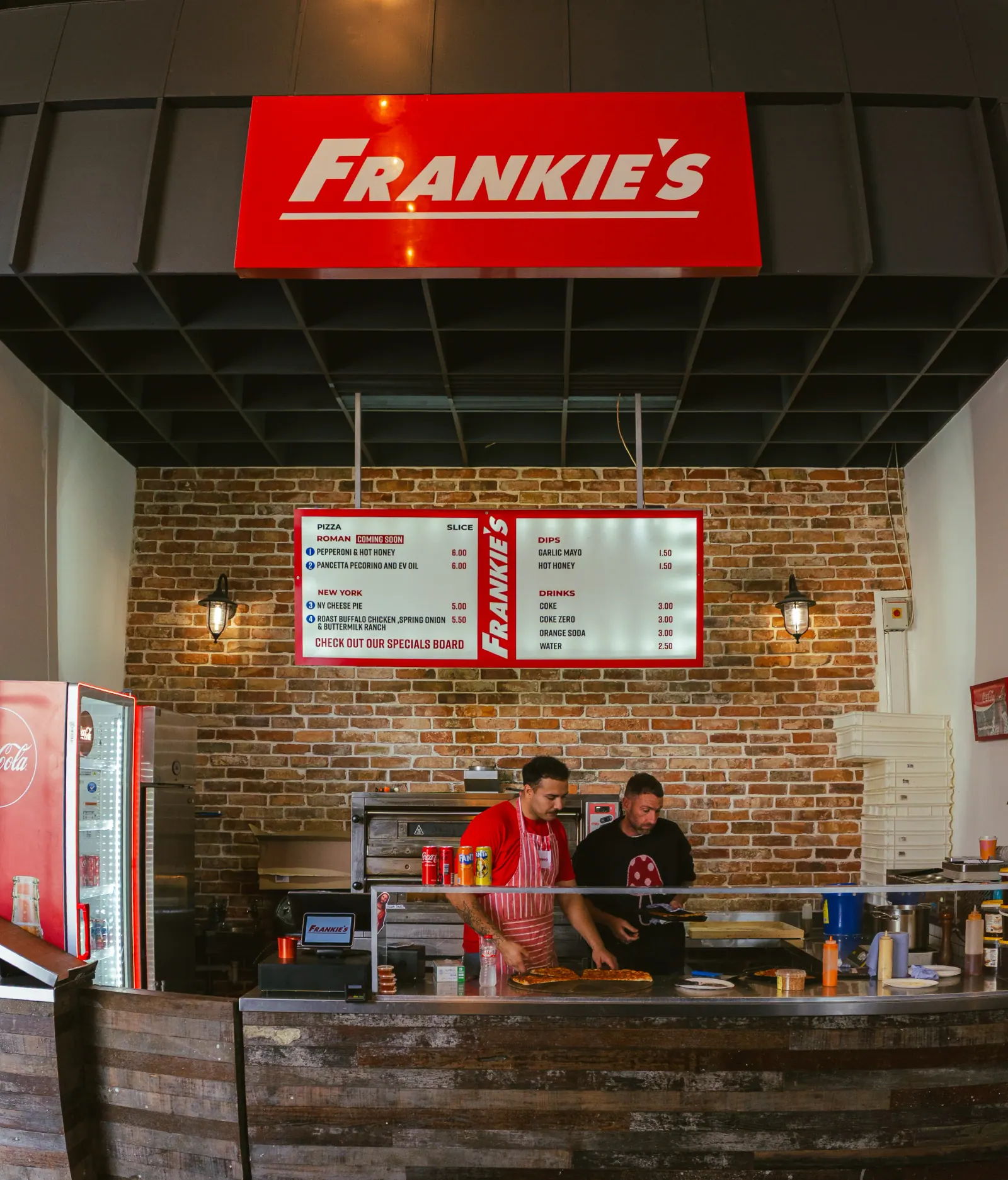 Pizza baking in the deck oven at Frankie's Slice Shop